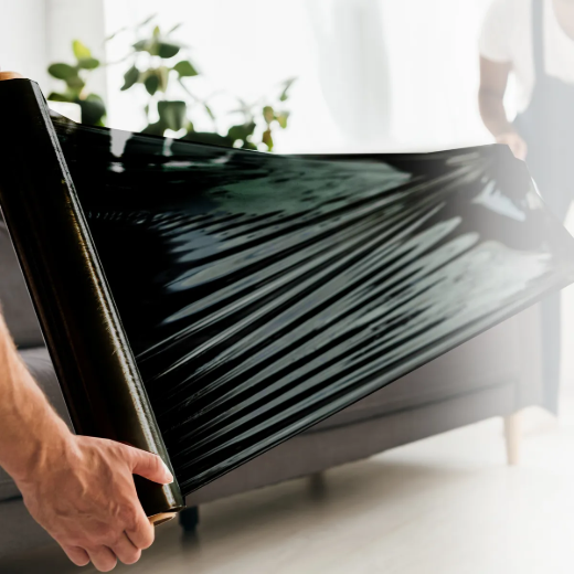 Picture of 4PK Hand Stretch Wrap Black 14 in x 1500ft 70GA. Bonus 1-Pair Handle